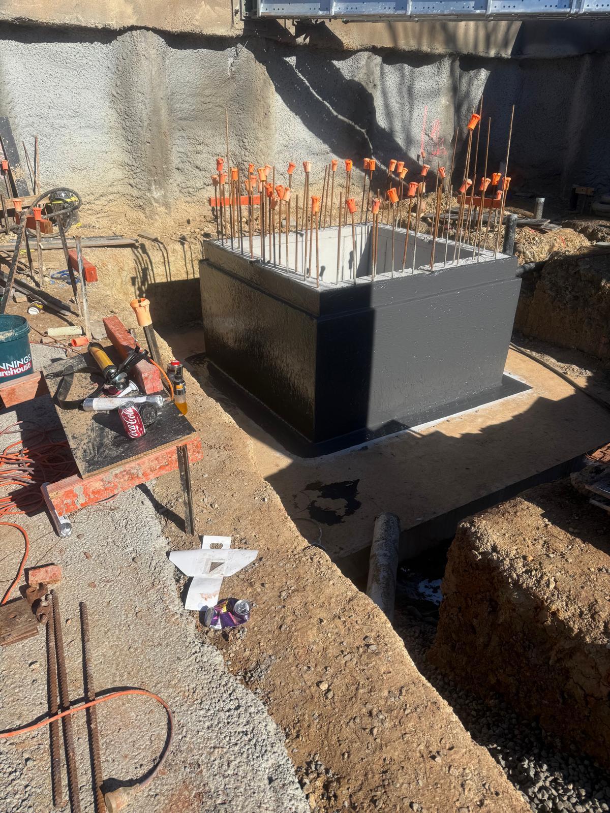 Lift pit box tanked externally in black membrane before backfill