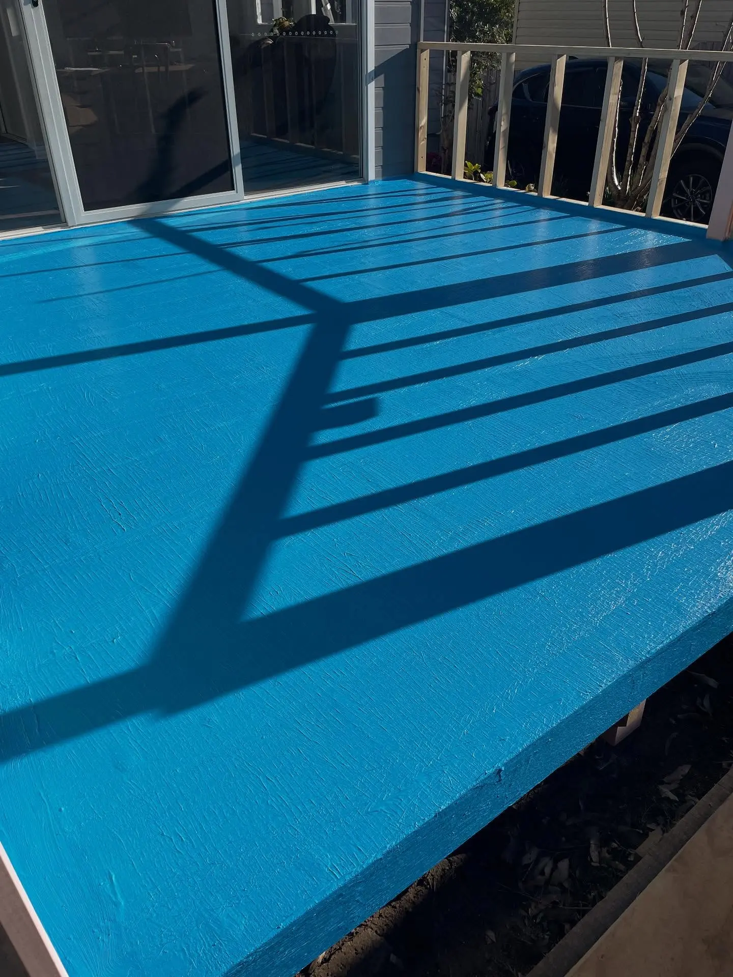 Balcony deck finished with blue waterproofing membrane
