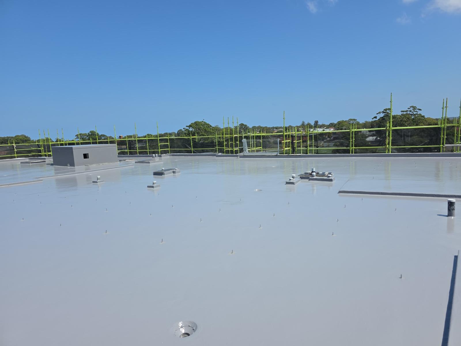 New roof deck fully sealed with grey membrane before services are installed