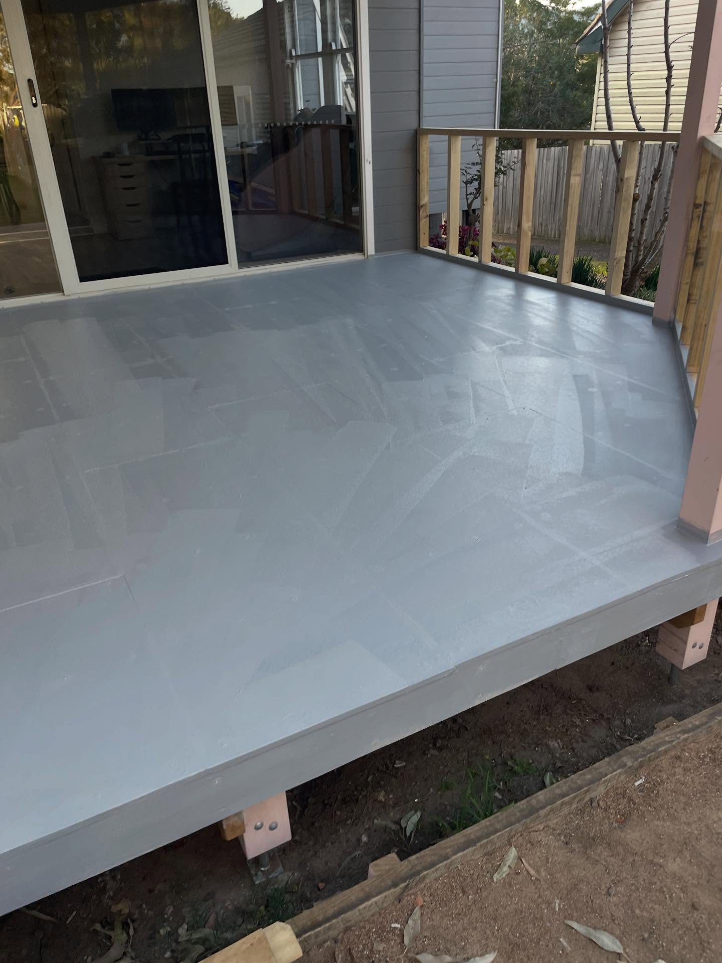 Balcony deck sealed with grey waterproofing membrane ready for topcoat
